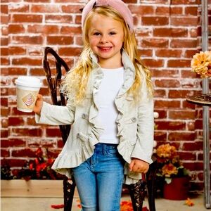 Long sleeve blazer-style cardigan with faux buttons and cascading ruffle hem